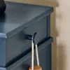 Close-up of a blue drawer knob with a rope hanging from it. Náhľad obrázku produktu