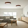 A modern living room with a sofa, coffee table, and a sideboard, illuminated by ceiling lights. Anteprima dell’immagine prodotto