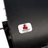 A close-up of a black grill with a logo on it. Podgląd zdjęcia produktu
