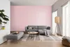 A living room scene with a sofa, ottoman, coffee table, rug, and floor lamp. Produktbild-Vorschau