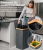 A woman is demonstrating the use of an inner bag for a trash can in a kitchen setting. Náhľad obrázku produktu