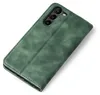 A green flip cover case for a Samsung Galaxy S23 phone, shown from a diagonal top-down view. Produktbild-Vorschau