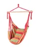 A striped hanging chair suspended from a wooden bar. Náhled obrázku produktu