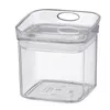 A clear, square plastic food storage container with a lid. Voir les images du produit