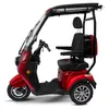 A red three-wheeled electric scooter with a canopy and a rear storage box, shown from a side-angle on a white background. Produktbild-Vorschau
