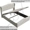 A beige upholstered bed frame with its storage mechanism open, showing the lift-up slats and the storage space underneath. Text annotations highlight features. Náhľad obrázku produktu
