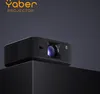 A black Yaber projector is displayed on a black pedestal against a dark gray background. Anteprima dell’immagine prodotto