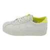 A single white sneaker with yellow accents is shown against a white background. Produktbild-Vorschau