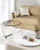 A living room scene with a couch, coffee table, and decorative items. Náhled obrázku produktu
