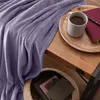 A cozy scene with a purple blanket, a mug of tea, and books. Anteprima dell’immagine prodotto