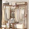 A wooden garment rack filled with clothes and storage bins. Produktbild-Vorschau
