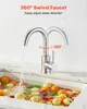 A faucet is shown over a sink filled with various fruits and vegetables. Anteprima dell’immagine prodotto