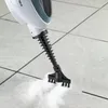 A steam mop head is shown cleaning a tiled floor, emitting steam. Náhled obrázku produktu