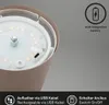 Close-up view of the top of a rechargeable table lamp, showing the LED lights and charging port, with informational icons and text. Anteprima dell’immagine prodotto