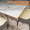 Close-up of a dining table with chairs, highlighting its rounded corners. Produktbild-Vorschau