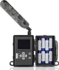 A trail camera with its battery compartment open, showing batteries. Voir les images du produit