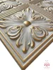 A close-up, angled view of a decorative 3D wall panel with a floral motif, highlighted with gold accents. Produktbild-Vorschau