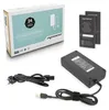 A product shot of a laptop AC adapter and its accessories, including the box, power brick, and cables, arranged on a white and light gray surface. Náhľad obrázku produktu