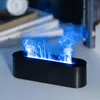 A black oval-shaped aroma diffuser emitting blue flame-like mist, placed on a light gray surface with blurred books in the background. Produktbild-Vorschau