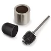 A toilet brush set with a holder and a lid, arranged on a white background. Anteprima dell’immagine prodotto