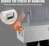 A person wearing gloves is holding a metal toolbox. Náhled obrázku produktu