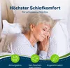 An elderly woman sleeping peacefully on a bed, with marketing text and icons overlayed. Produktbild-Vorschau