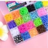 A clear plastic container filled with colorful loom bands, organized into compartments. Náhled obrázku produktu