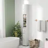 A bathroom with a white freestanding tub, a tall white cabinet with shelves and drawers, and a large potted plant. Produktbild-Vorschau