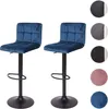 Two blue velvet bar stools with black bases are shown against a white background. Voir les images du produit