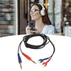 A woman wearing headphones is looking at her phone, with a product cable in the foreground. Podgląd zdjęcia produktu