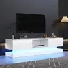 A modern white TV stand with LED lighting is shown in a living room setting. Produktbild-Vorschau