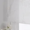 A close-up view of a white sheer curtain with a delicate silver lotus pattern, partially covering a window. Produktbild-Vorschau