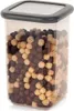 A square, clear plastic food storage container filled with mixed chocolate and vanilla cereal balls, with a dark gray lid. Anteprima dell’immagine prodotto