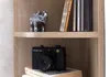 A shelf with decorative items and books. Anteprima dell’immagine prodotto