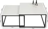 A set of two white nesting coffee tables with black metal frames, shown from a slightly elevated front-left angle against a white background. Dimensions are indicated with measurement lines and text. Voir les images du produit