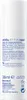 The image shows the back of a white bottle with product information and instructions printed on it. Produktbild-Vorschau