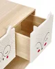 A close-up view of a wooden nightstand with two drawers, one of which is open, revealing the interior. The drawer fronts are decorated with cute animal faces. Náhled obrázku produktu