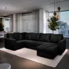A modern living room with a large black sectional sofa, a rug, and a large window with a city view. Produktbild-Vorschau