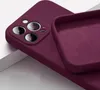 Close-up of a plum-colored iPhone 13 Mini silicone case, showing the camera cutout and the interior lining. Produktbild-Vorschau