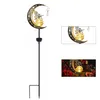 A solar garden light shaped like a crescent moon with a fairy and a light bulb. Produktbild-Vorschau