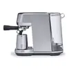 A side view of a silver espresso machine with a clear water tank. Produktbild-Vorschau
