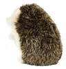 A plush toy hedgehog sitting on a white background. Produktbild-Vorschau