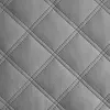 A close-up view of quilted gray material, likely upholstery or padding, with diamond-shaped stitching. Náhled obrázku produktu
