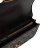 Close-up view of the interior of a black handbag, showing a zippered compartment. Náhled obrázku produktu