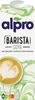 A carton of Alpro Barista Soya milk with a cup of latte art in the foreground. Produktbild-Vorschau