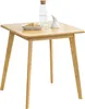 A small square bamboo table with a bottle of water and a plate of food on it. Podgląd zdjęcia produktu