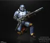 A Star Wars Black Series action figure of Paz Vizsla in a dynamic pose, holding a large weapon, against a black background. Produktbild-Vorschau