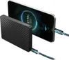 A black power bank is connected to a smartphone via USB-C cables, showing the phone's charging screen. Produktbild-Vorschau