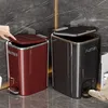 Two pedal trash cans are shown in a bathroom setting, with a hand opening one and a foot pressing the pedal of the other. Produktbild-Vorschau