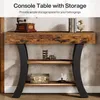 A console table with storage shelves, decorated with vintage items and books. Anteprima dell’immagine prodotto